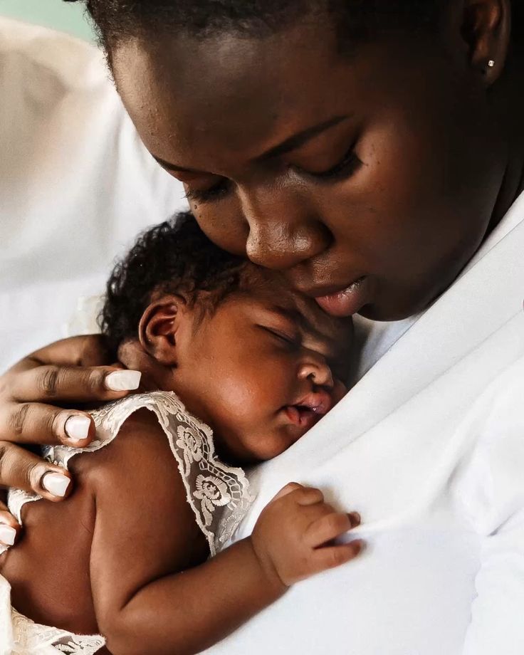 A mother holding her newborn